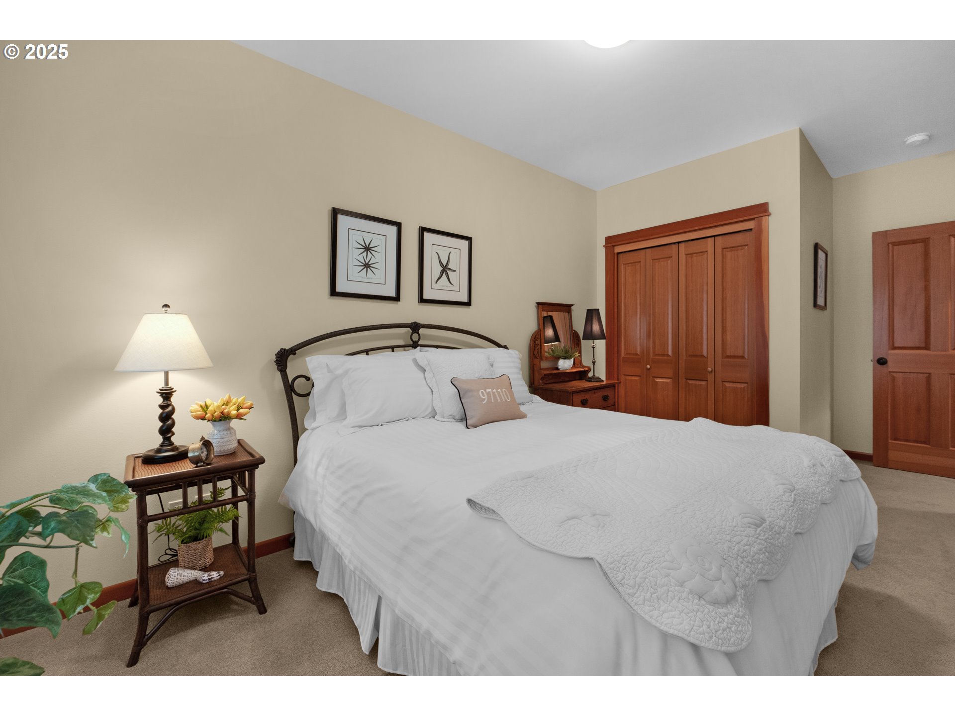 123 South Hemlock Street, Unit 201 Cannon Beach, OR 97110 - Photo 43 of 48 a bedroom with a bed and a night stand