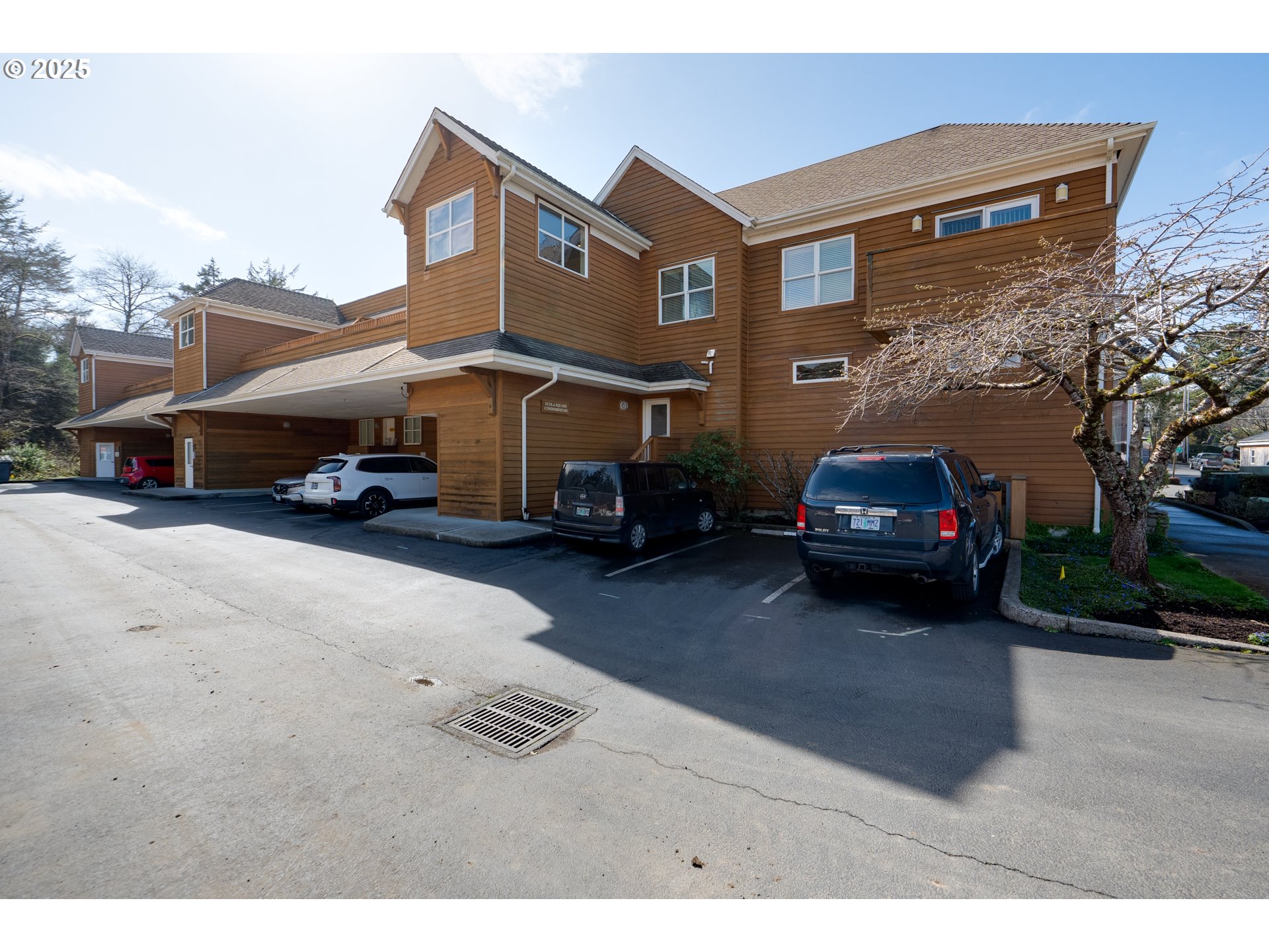 123 South Hemlock Street, Unit 201 Cannon Beach, OR 97110 - Photo 8 of 48 a car parked in front of a house