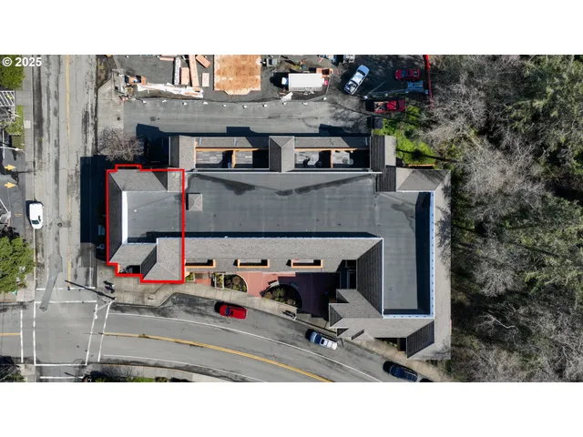 a living room with furniture and a mirror