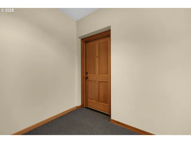 a view of a livingroom with furniture and a mirror