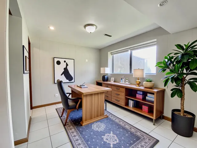 a workspace with furniture and window