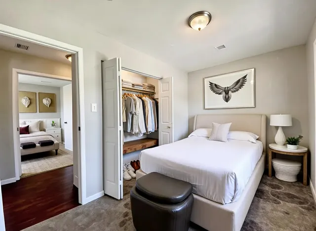 a bedroom with a bed and a view of bathroom