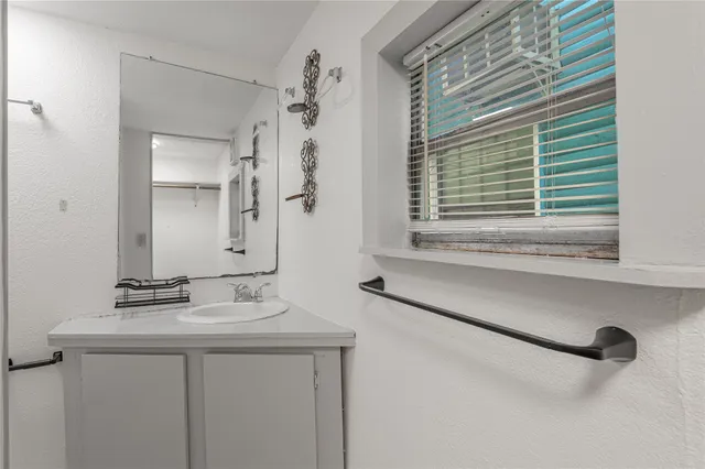 a bathroom with a tub and a toilet