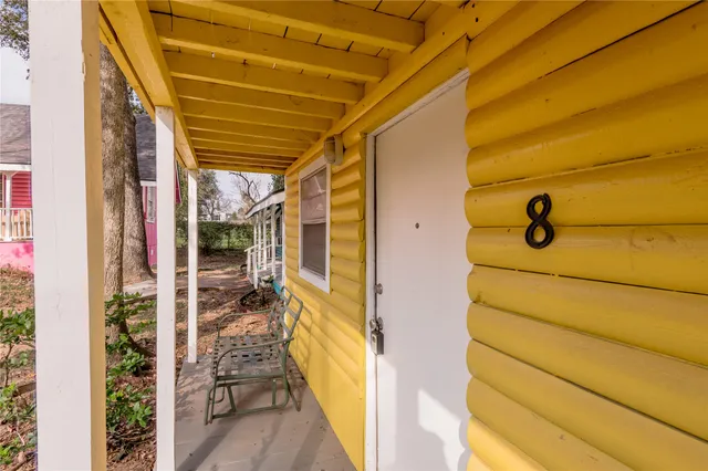 a view of a door and wooden floor