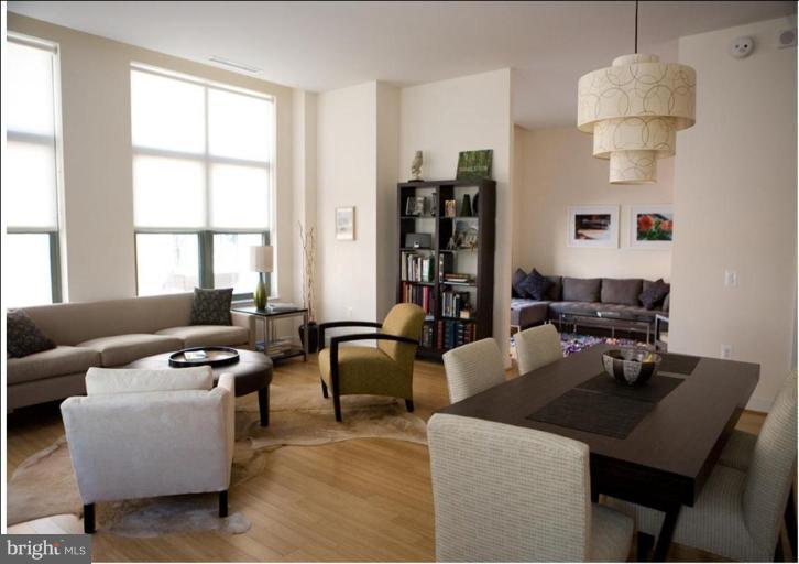 2425 L Street Northwest, Unit 617 Washington, DC 20037 - Photo 1 of 8 a living room with furniture and a window