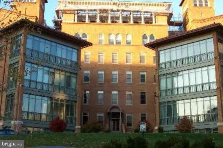 2425 L Street Northwest, Unit 617 Washington, DC 20037 - Photo 2 of 8 a large building with a lot of windows