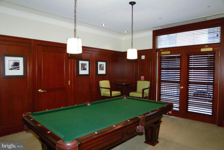 2425 L Street Northwest, Unit 617 Washington, DC 20037 - Photo 4 of 8 a room with pool table and windows