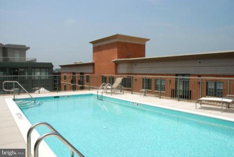 2425 L Street Northwest, Unit 617 Washington, DC 20037 - Photo 6 of 8 a view of a house with swimming pool