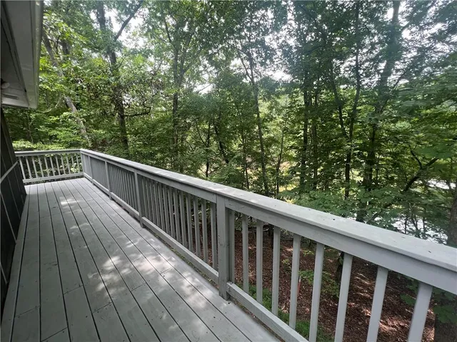 a view of balcony with wooden floor