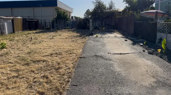 a view of a backyard of the house