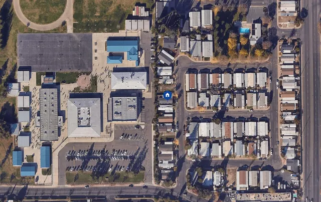 a front view of a large building and a street