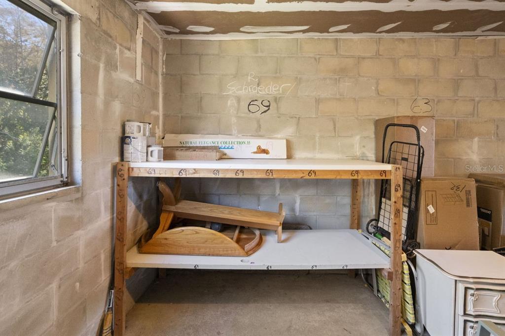 2391 Sumatran Way, Unit 69 Clearwater, FL 33763 - Photo 25 of 50 a room with a mirror and a sink