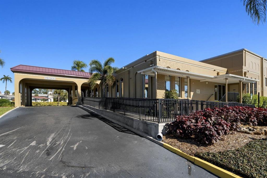 2391 Sumatran Way, Unit 69 Clearwater, FL 33763 - Photo 28 of 50 a front view of a house with a garden