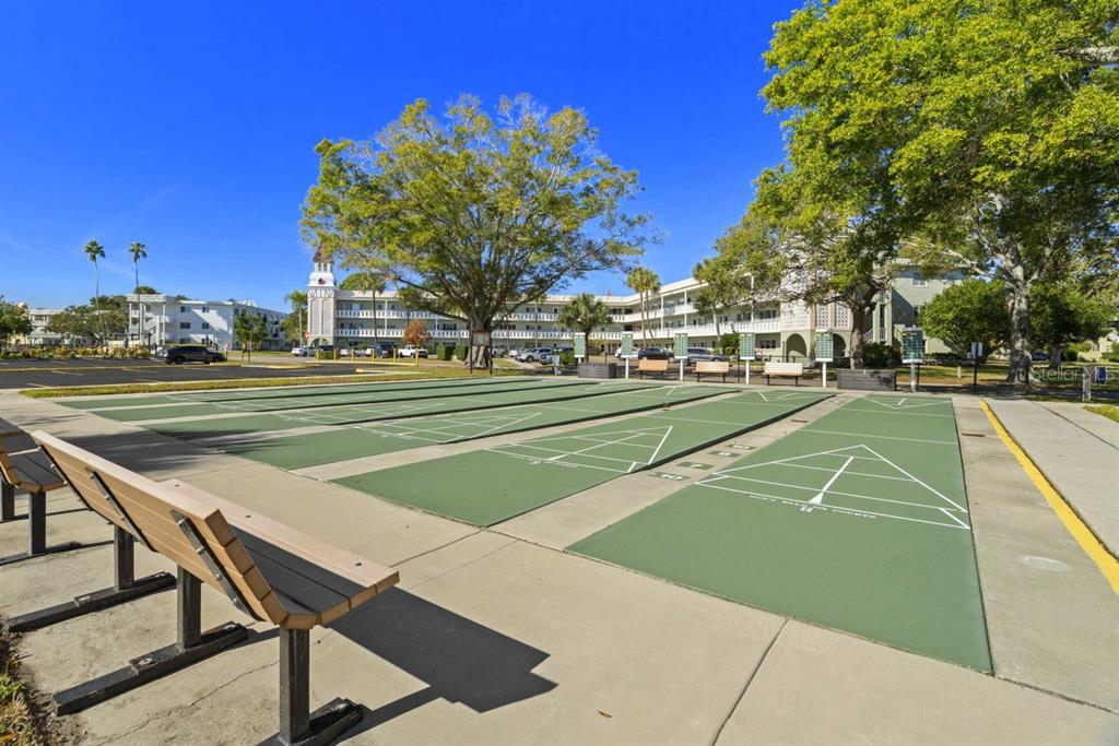 2391 Sumatran Way, Unit 69 Clearwater, FL 33763 - Photo 41 of 50 a view of a tennis ground with large trees