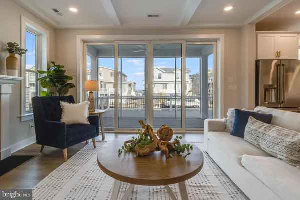 a kitchen with stainless steel appliances a stove a sink island and a refrigerator