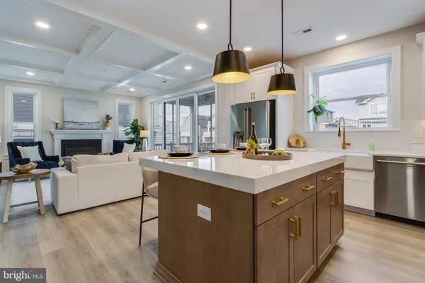 a kitchen with stainless steel appliances a stove a sink and a microwave