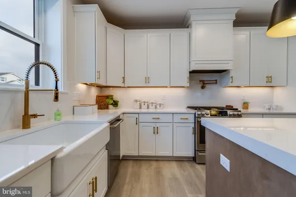 a view of staircase with railing and white walls