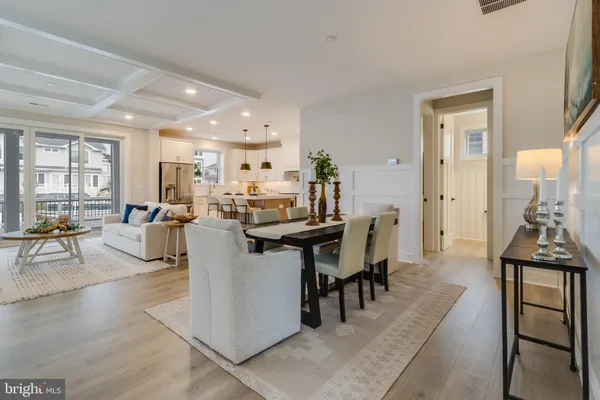 a kitchen with stainless steel appliances granite countertop a stove and a refrigerator