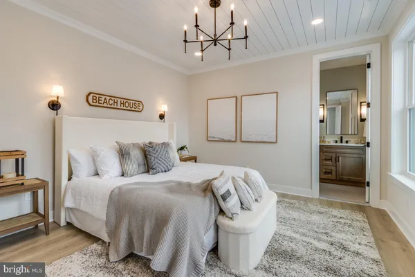 a spacious bedroom with a bed and a couch