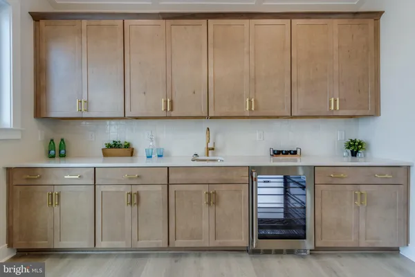 a view of a roof deck with wooden floor and fence