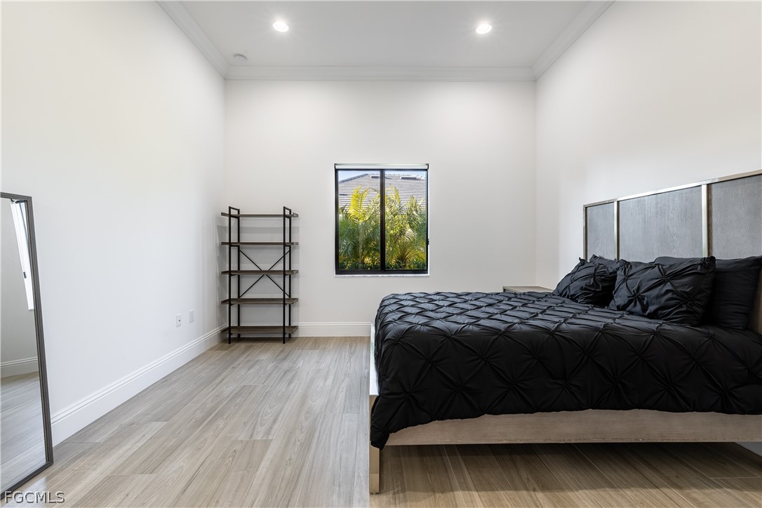 3337 Chestnut Grove Drive Alva, FL 33920 - Photo 11 of 50 a bedroom with a bed and a window