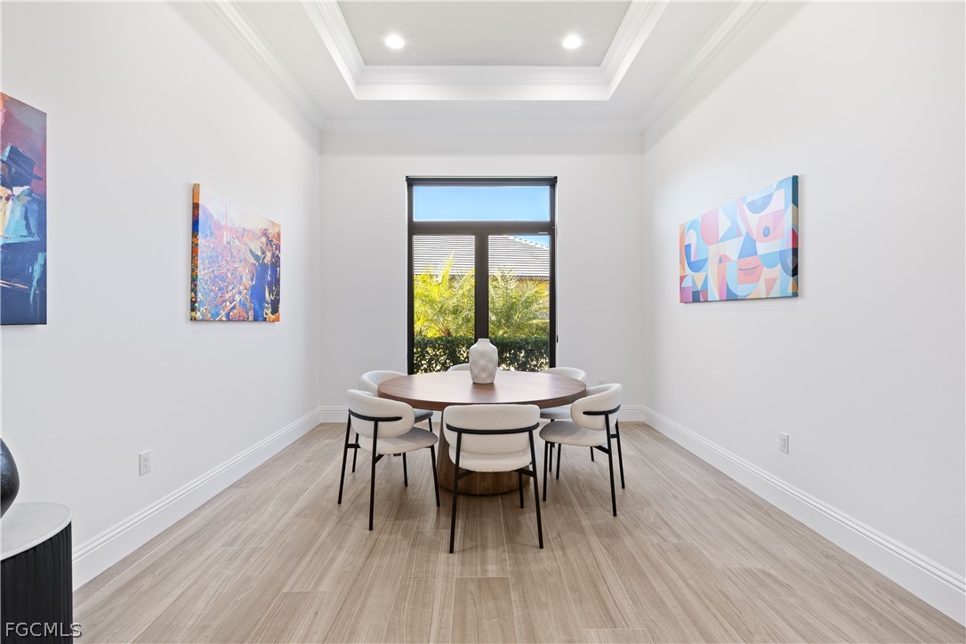 3337 Chestnut Grove Drive Alva, FL 33920 - Photo 13 of 50 a dining room with furniture a rug and wooden floor