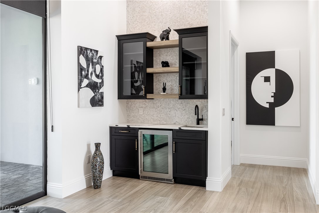 3337 Chestnut Grove Drive Alva, FL 33920 - Photo 28 of 50 a kitchen with stainless steel appliances granite countertop a refrigerator and a stove top oven