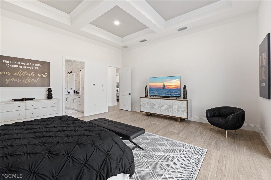 3337 Chestnut Grove Drive Alva, FL 33920 - Photo 30 of 50 a bedroom with a bed and a flat screen tv