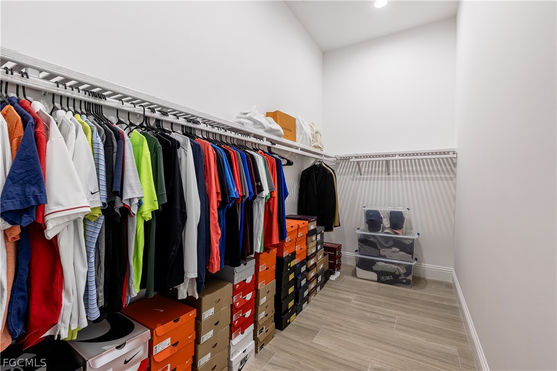 3337 Chestnut Grove Drive Alva, FL 33920 - Photo 34 of 50 a view of walk in closet with clothes and shoes