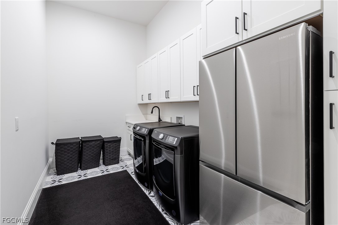 3337 Chestnut Grove Drive Alva, FL 33920 - Photo 38 of 50 a view of a storage and utility room with washer and dryer