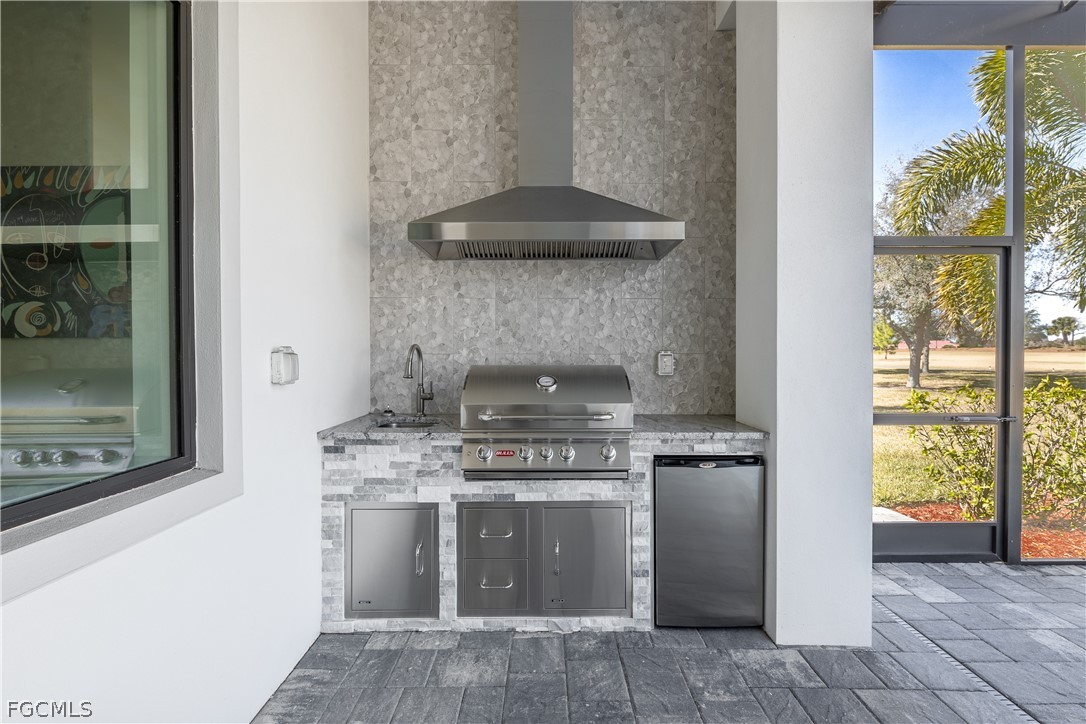 3337 Chestnut Grove Drive Alva, FL 33920 - Photo 41 of 50 a stove top oven sitting inside of a kitchen