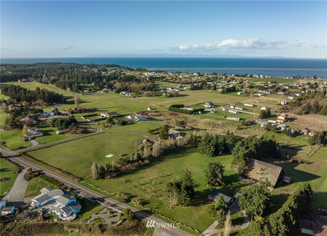 999 Lotzgesell Road Sequim, WA 98382 - Photo 3 of 29 an aerial view of residential houses with outdoor space