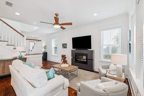 a kitchen with granite countertop white cabinets and stainless steel appliances