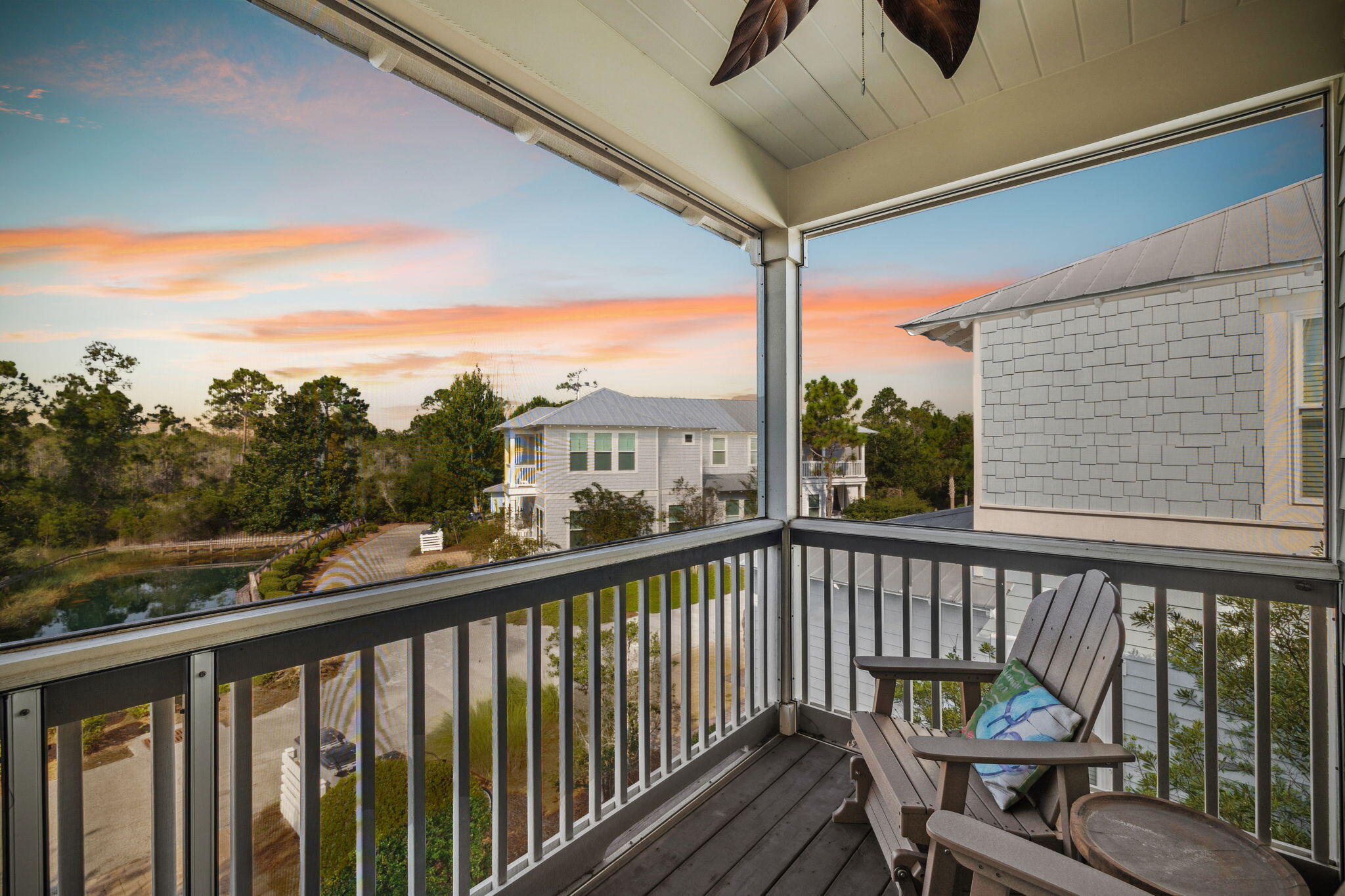 844 Sandgrass Boulevard Santa Rosa Beach, FL 32459 - Photo 2 of 74 a view of a balcony with wooden floor and outdoor seating