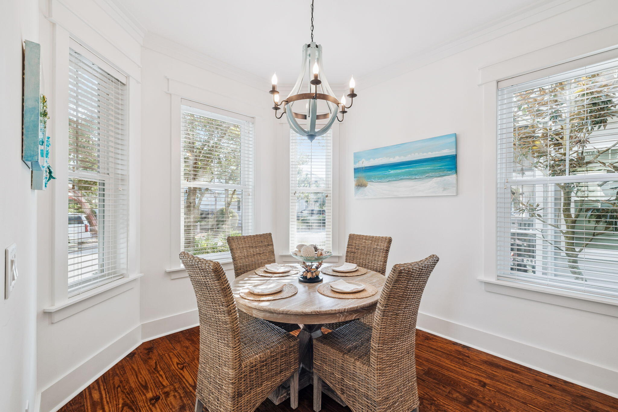 844 Sandgrass Boulevard Santa Rosa Beach, FL 32459 - Photo 21 of 74 a dining room with furniture a chandelier and wooden floor