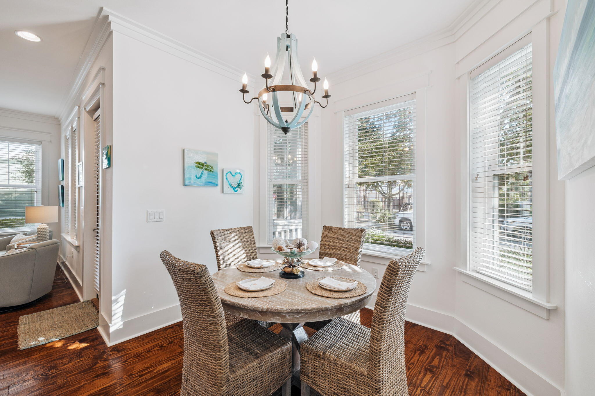 844 Sandgrass Boulevard Santa Rosa Beach, FL 32459 - Photo 22 of 74 a view of a dining room with furniture wooden floor and chandelier