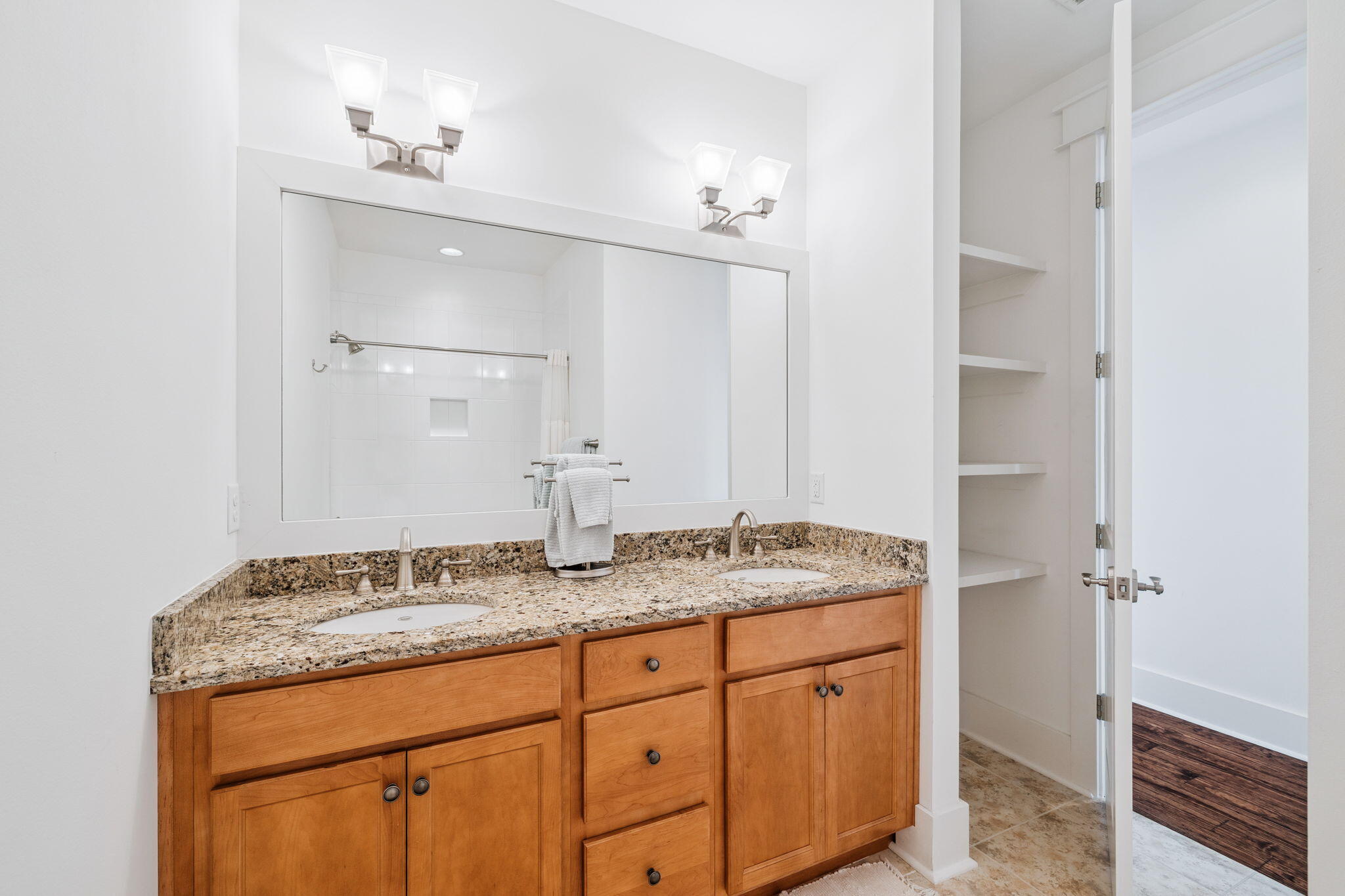 844 Sandgrass Boulevard Santa Rosa Beach, FL 32459 - Photo 52 of 74 a bathroom with a granite countertop sink and a mirror