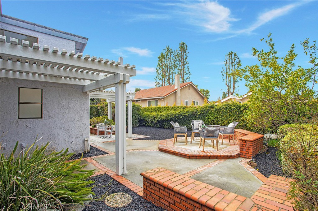 11 Ensueno West Irvine, CA 92620 - Photo 26 of 36 a view of a patio with table and chairs potted plants