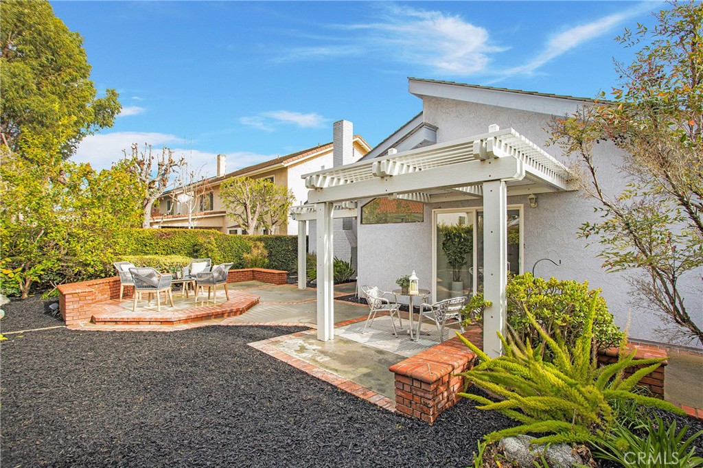 11 Ensueno West Irvine, CA 92620 - Photo 28 of 36 a view of a patio with table and chairs potted plants