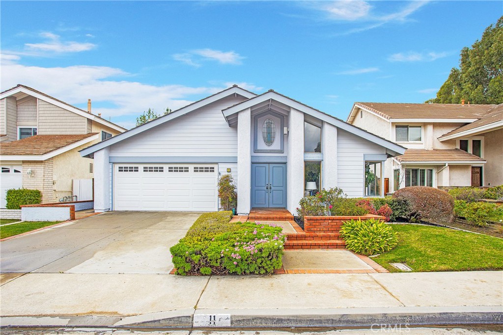 11 Ensueno West Irvine, CA 92620 - Photo 32 of 36 a front view of a house with garden