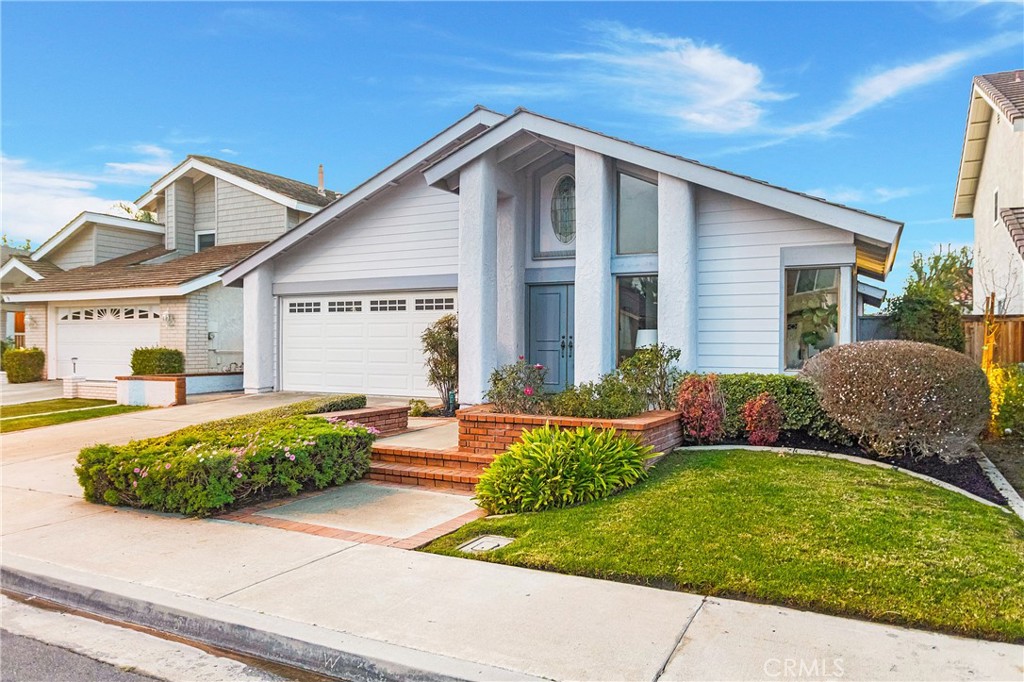 11 Ensueno West Irvine, CA 92620 - Photo 34 of 36 a front view of a house with a yard