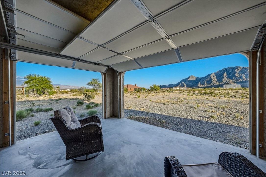 4892 Quail Run Road Pahrump, NV 89060 - Photo 59 of 90 RV Garage Patio- Enjoy expansive RV garage living roommountain views from this unique indoor-outdoor space.