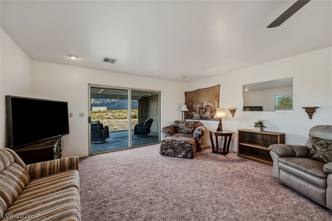 4892 Quail Run Road Pahrump, NV 89060 - Photo 60 of 90 RV garage family room