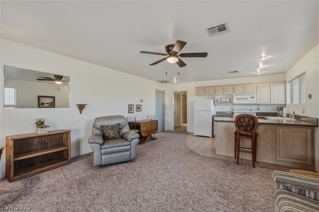 4892 Quail Run Road Pahrump, NV 89060 - Photo 62 of 90 RV garage family room