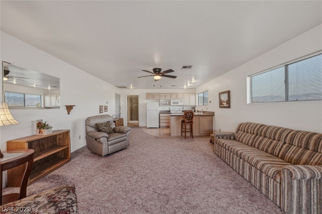 4892 Quail Run Road Pahrump, NV 89060 - Photo 63 of 90 RV garage family room
