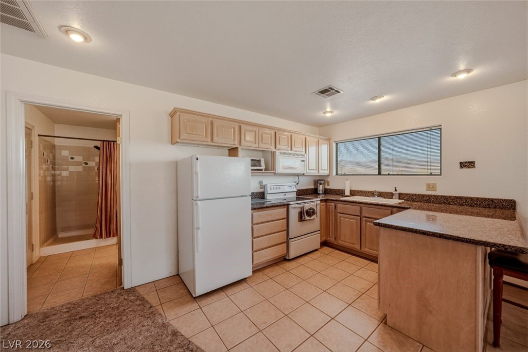 4892 Quail Run Road Pahrump, NV 89060 - Photo 67 of 90 RV garage family room