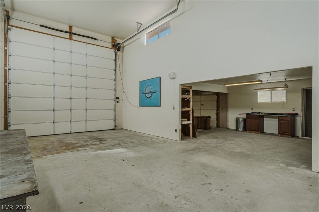 4892 Quail Run Road Pahrump, NV 89060 - Photo 71 of 90 This spacious garage offers ample room for vehicles and projects.