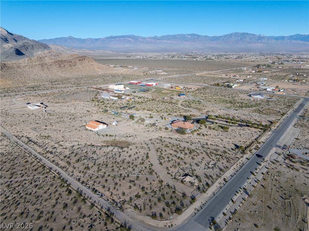 4892 Quail Run Road Pahrump, NV 89060 - Photo 83 of 90 Expansive desert property with panoramic mountain views and open skies, offering vast potential for development.