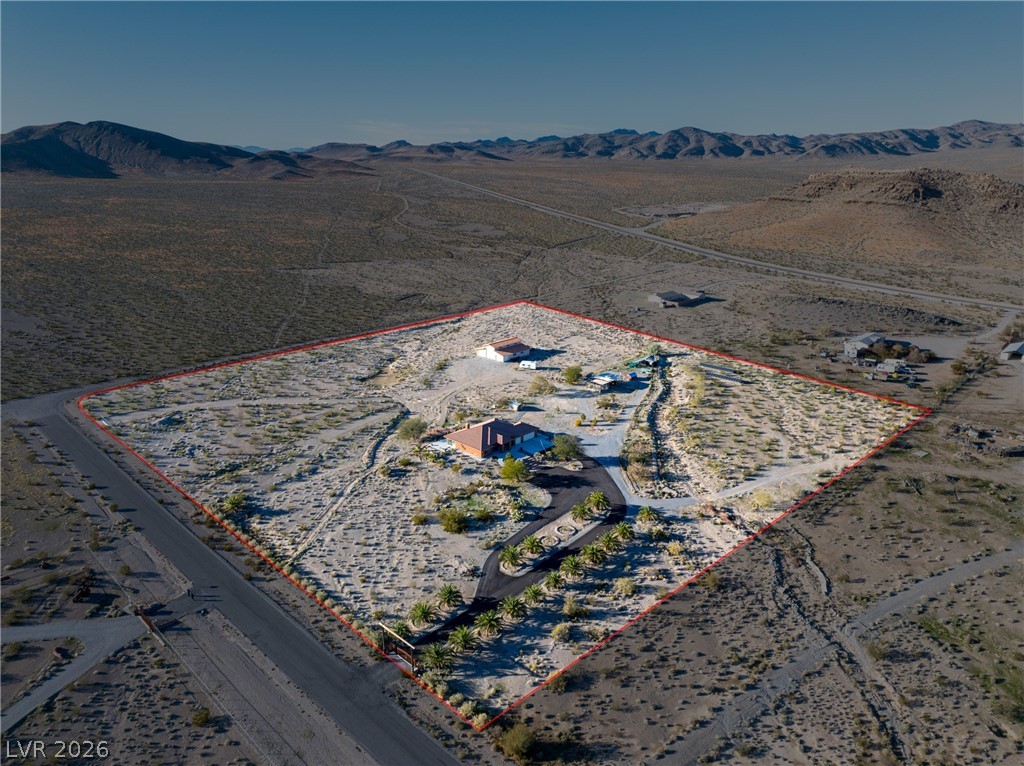 4892 Quail Run Road Pahrump, NV 89060 - Photo 84 of 90 This desert estate offers a secluded sanctuary amidst vast, serene landscapes.