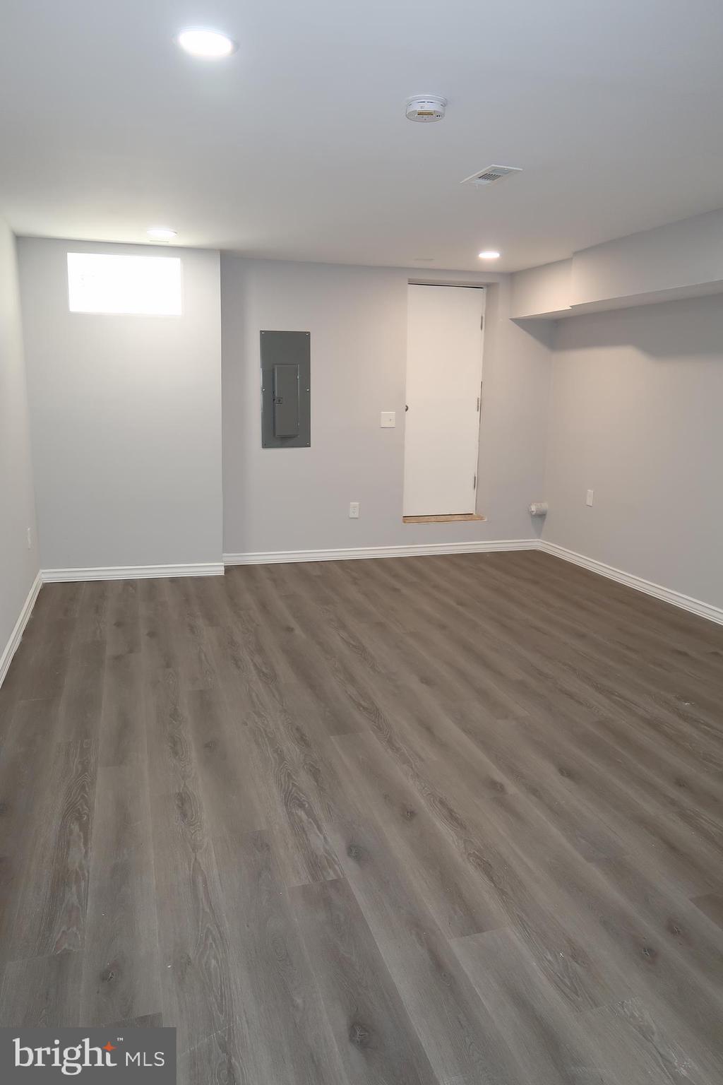 2833 Brendan Avenue, Unit 1 Baltimore, MD 21213 - Photo 22 of 26 a view of an empty room with wooden floor